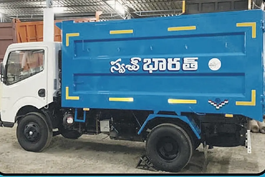 Falcon Eye waste collection truck with its cab and both wheels visible