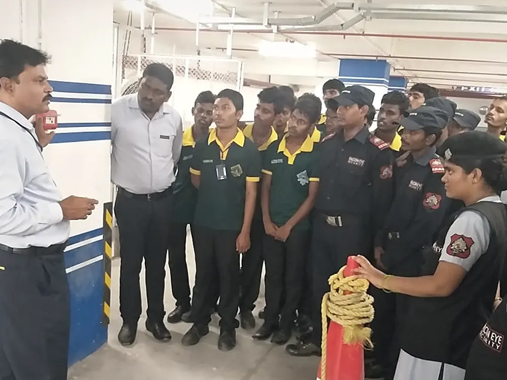 Falcon Eye supervisor briefing a mixed security and housekeeping team